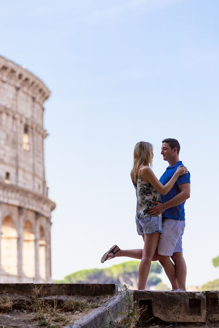 Young couple during their surprise proposal in Rome