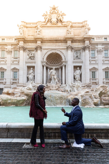 Morning surprise proposal at the Trevi Fountain in Rome
