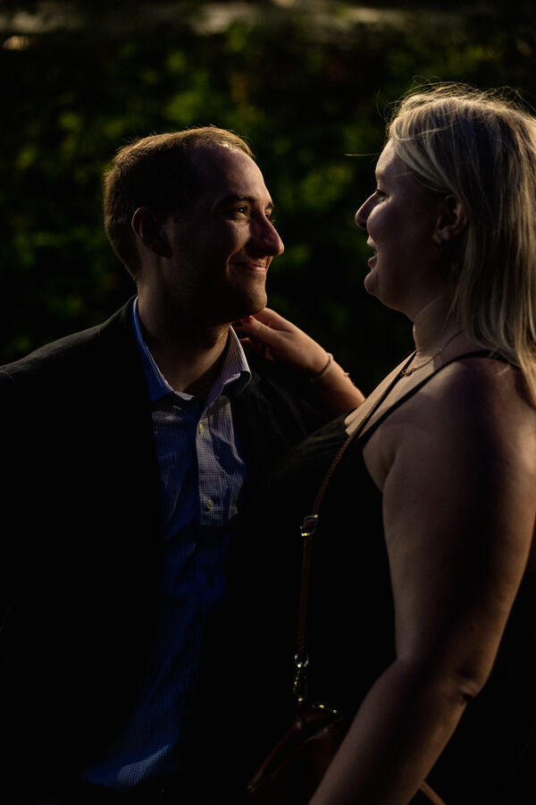 Low-key portrait of newly-engaged couple on their surprise marriage proposal photo shoot in Rome
