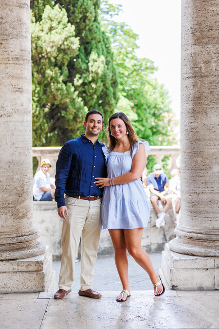 Newly-engaged couple smiling while on the Capitoline Hill in Rome