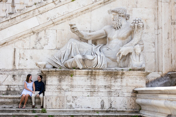 Newly-engaged couple on the Capitoline Hill next to the Nile river god statue