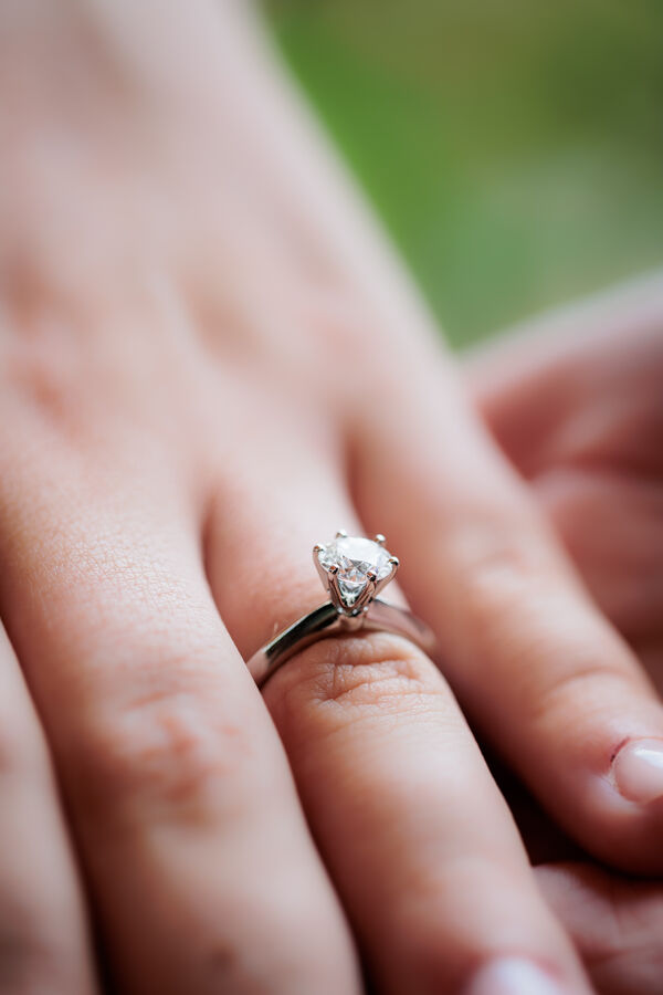 Close-up of the engagement ring on a surprise proposal photo session in Rome