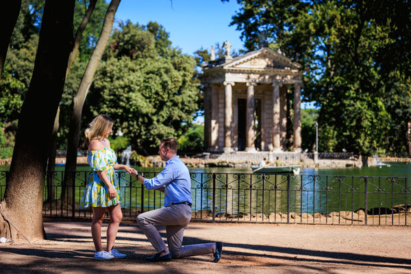 Surprise wedding proposal at the Aesculapius Temple on the lake in Villa Borghese in Rome