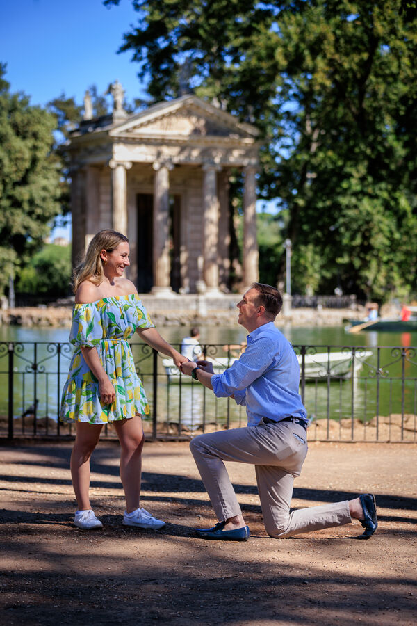 Surprise marriage proposal at the Aesculapius Temple on the lake in Villa Borghese in Rome