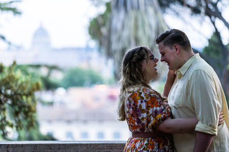 Happy couple during their surprise proposal photo session in Rome