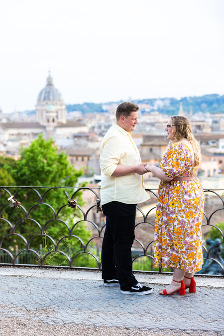 Couple on the Pincial Hill at sunset during their surprise proposal in Rome