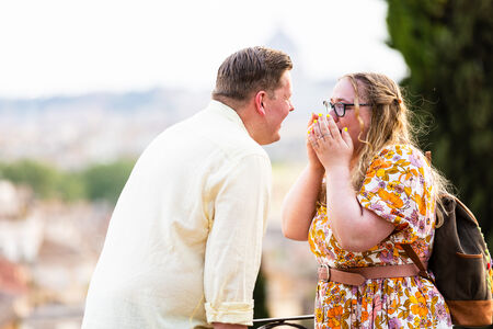 Happy couple during their surprise proposal photo shoot at the Pincio Gardens in Rome
