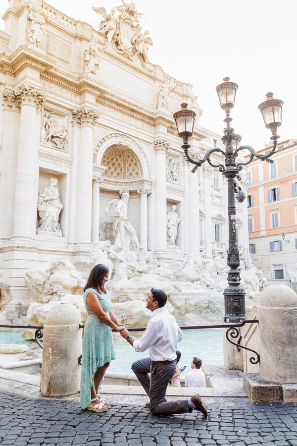 Surprise marriage proposal at the Trevi Fountain at sunrise in Rome