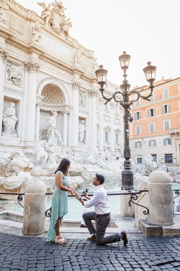 Romantic surprise proposal at the Trevi Fountain very early in the morning
