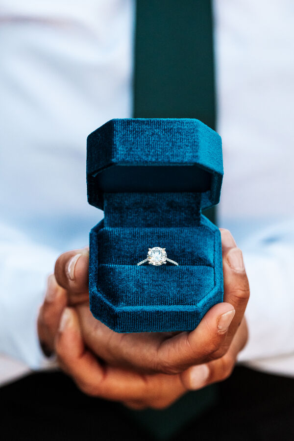Close-up of an engegement ring during a same-sex surprise marrigae proposal photoshoot in Rome