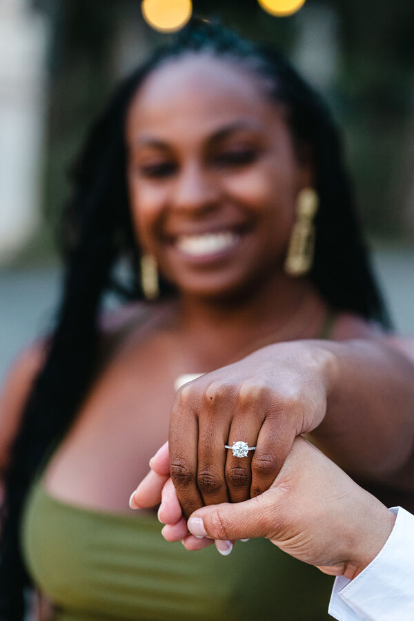 Newly-enganged fiancée showing off her engagement ring during her marriage proposal photoshoot in Rome