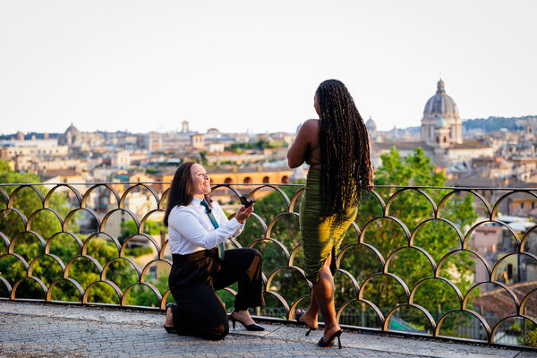 Lesbian couple proposing on the Terrazza Belvedere in Rome at sunset