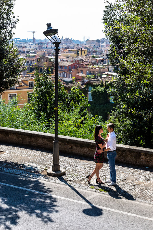 Beautiful couple holding each other while on their vacation photo session in Rome