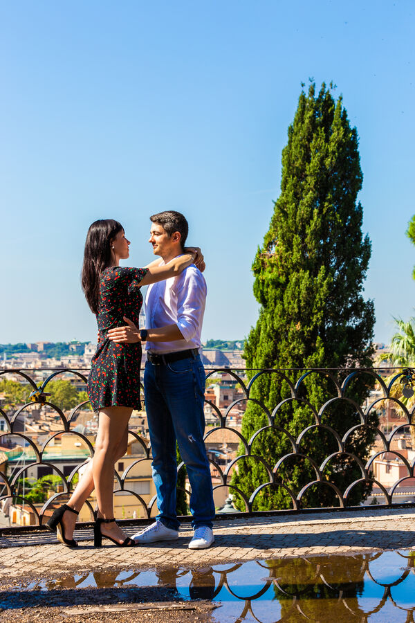 Couple on vacation in Rome holding each other during their vacation photoshoot in Rome
